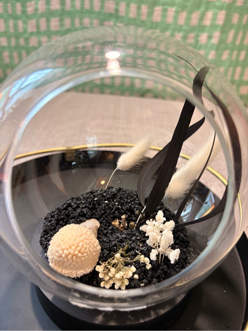 Decorative Glass decor w. faux black sand, feathers and fauna.
Perfect addition